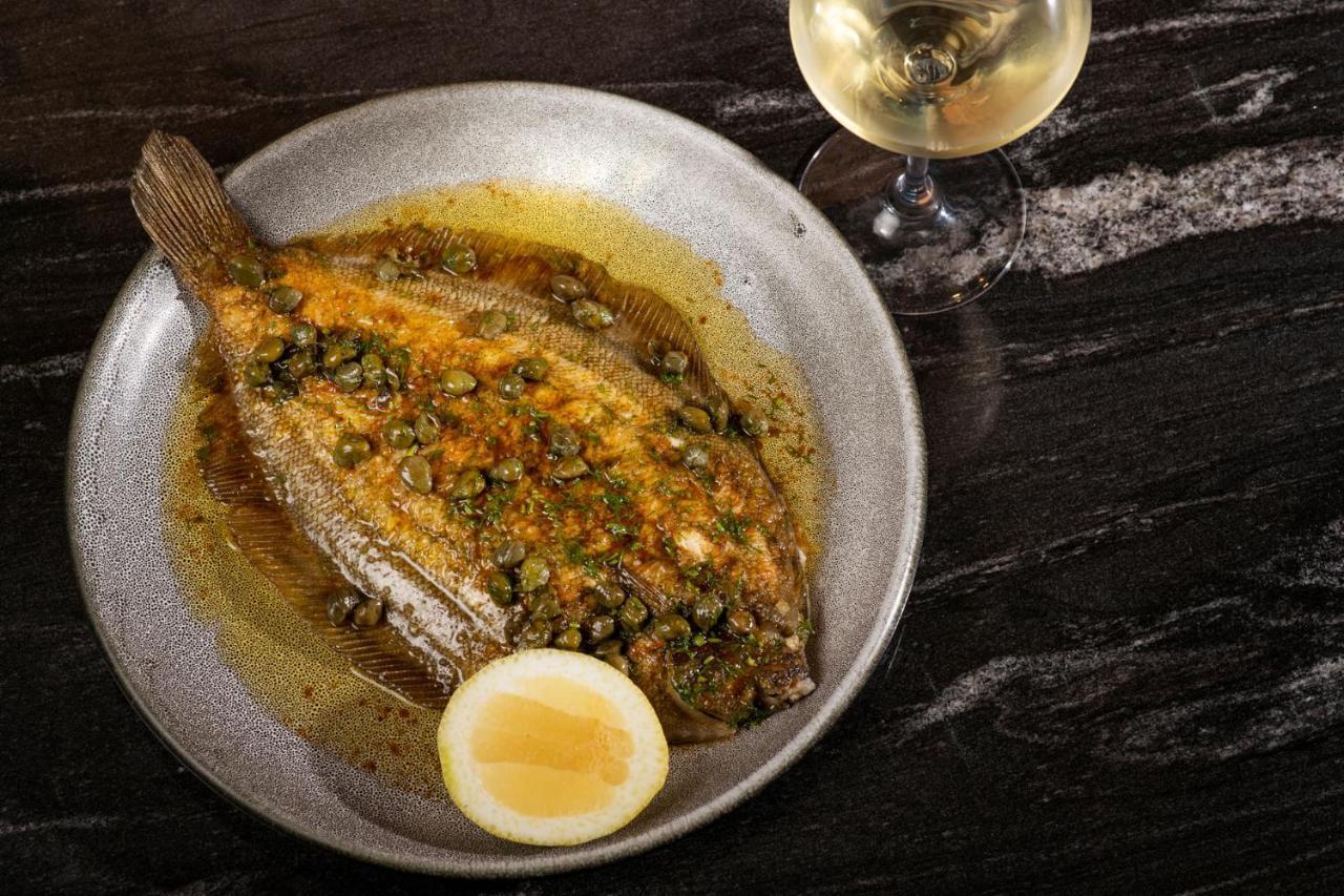 Qt Queenstown Exterior foto A turbot prepared in a French restaurant